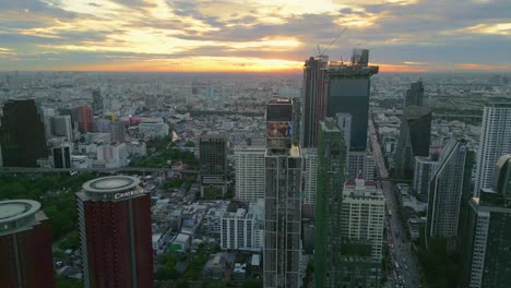 drone cityscape smart city skyline at sunset with construction crane modern office building