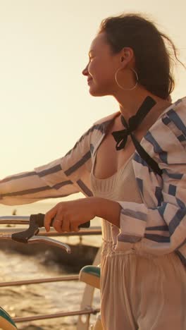 woman riding a bike on the beach at sunset