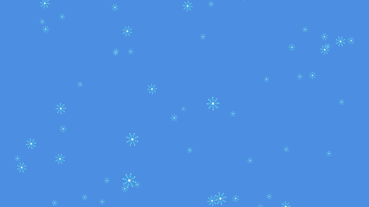 Glowing snow particles falling against blue background