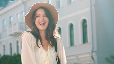 woman in a beige hat and white blouse