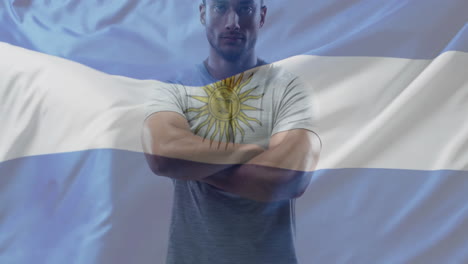 animation of flag of argentina over biracial male strong man