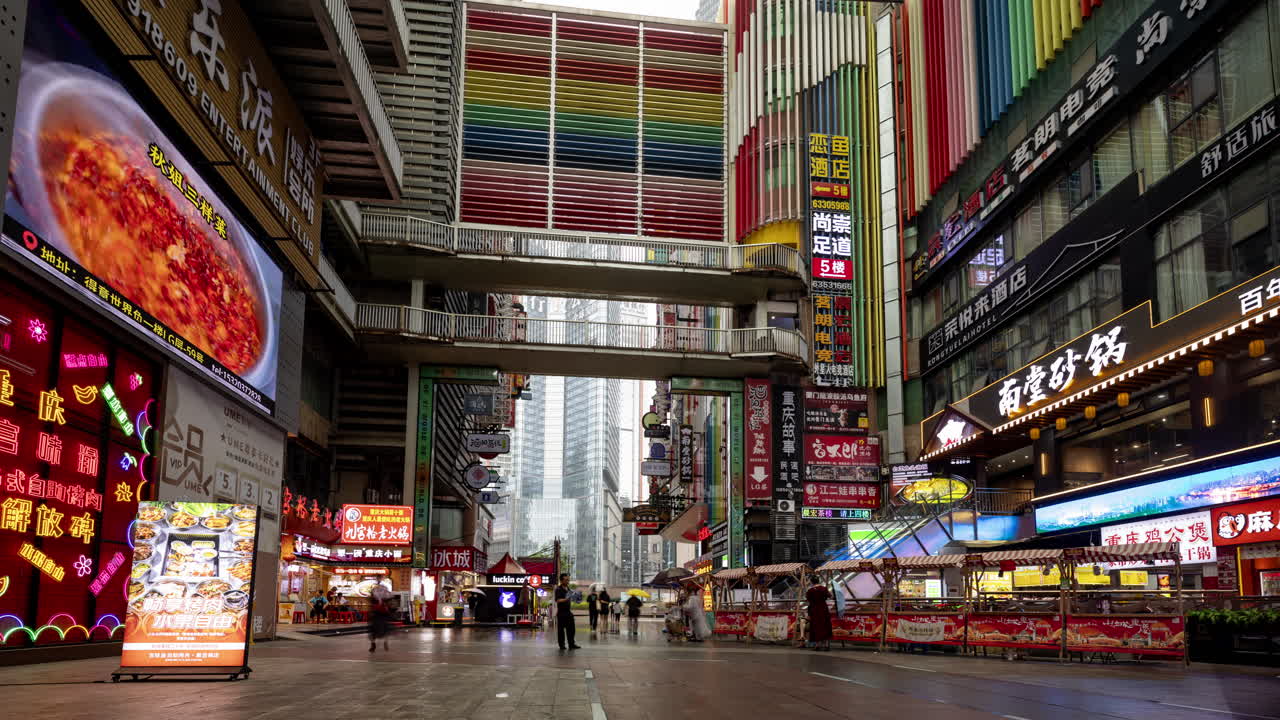 CHONGQING, CHINA - 28 MAY 2025 : Timelapse of the amazing Chongqing cyberpunk city neon street scene in the rain at night