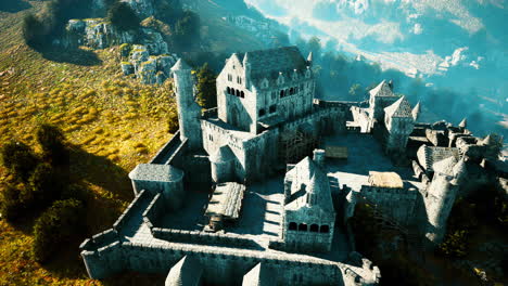 aerial view of a majestic, historic castle in a mountainous landscape