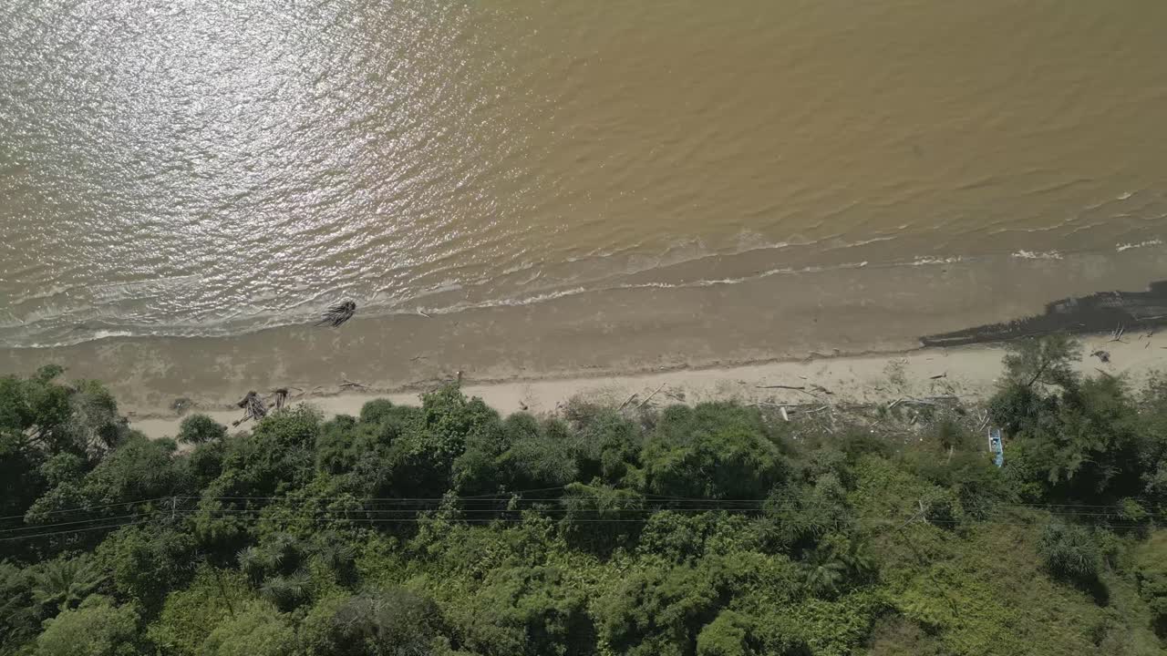 Aerial Drone View During Summer Alit Fishing Village,Kabong With, Facing Open Blue Sea, White Sandy Beach,Green Coconut, Palm Trees,And River,Sarawak,Borneo