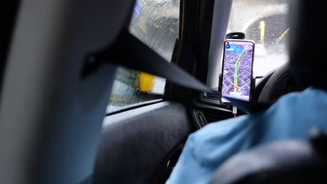 navigation app in a car during rainy weather