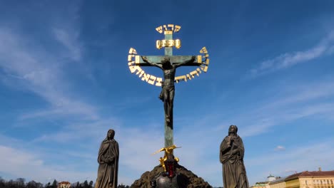 the crucifix and calvary statues on charles bridge in prague, czech republic