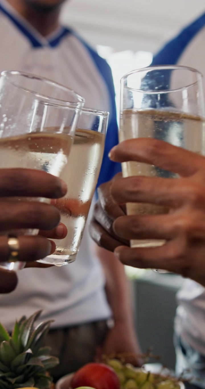 Group of Friends Toasting with Glasses of White Wine