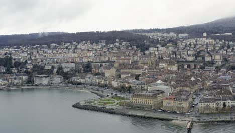 The-romantic-village-Neuchâtel-located-on-the-beautiful-lake-during-the-winter-season-in-the-swiss-alpine-landscape,-Switzerland,-Europe