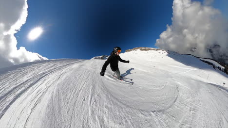 a young skier is going down a ski slope in the swiss alps, selfie view with 360 gopro