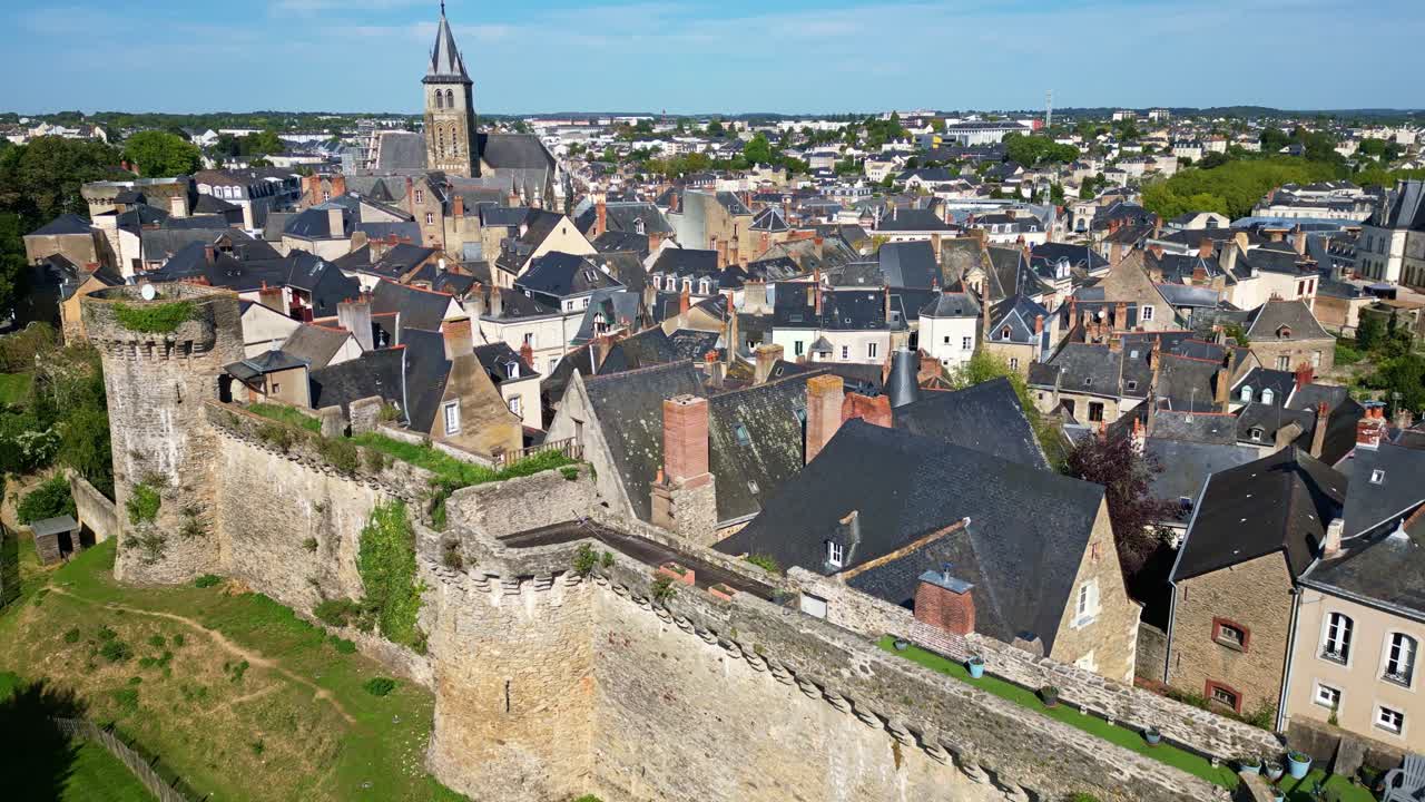 Aerial of Laval southern ramparts with Cathedral of Saint Trinite in the background, establishing