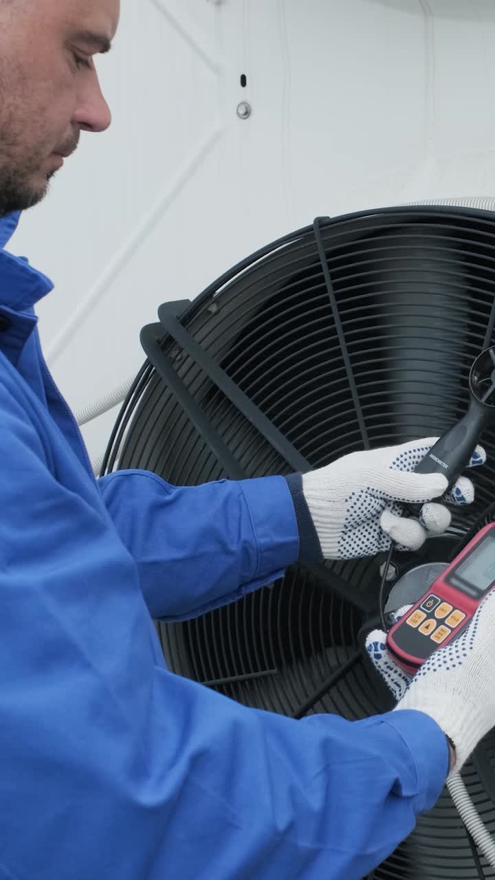 HVAC Technician Inspecting Air Conditioning System