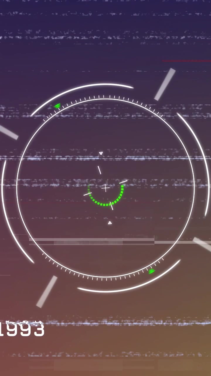 Video verticale: HUD centrato in fase di avvio, anello verde che ruota attorno al mirino, mostrando una scansione tecnologica.