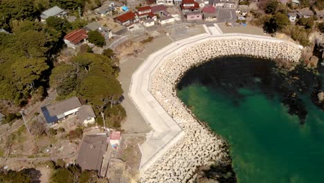 slow aerial tilt up over tashirojima cat island in japan