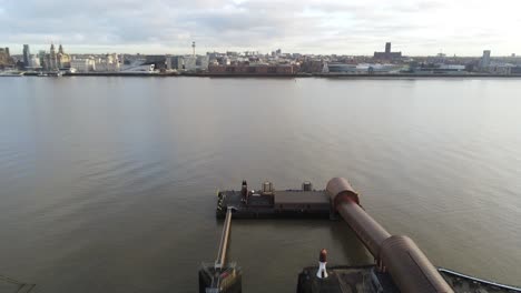 Woodside-ferry-village-terminal-aerial-view-Birkenhead-Liverpool-harbour-skyline-pigeons-fly-through-shot