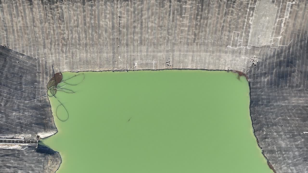 Aerial dam in the forest, drone view of dam lake in green forest