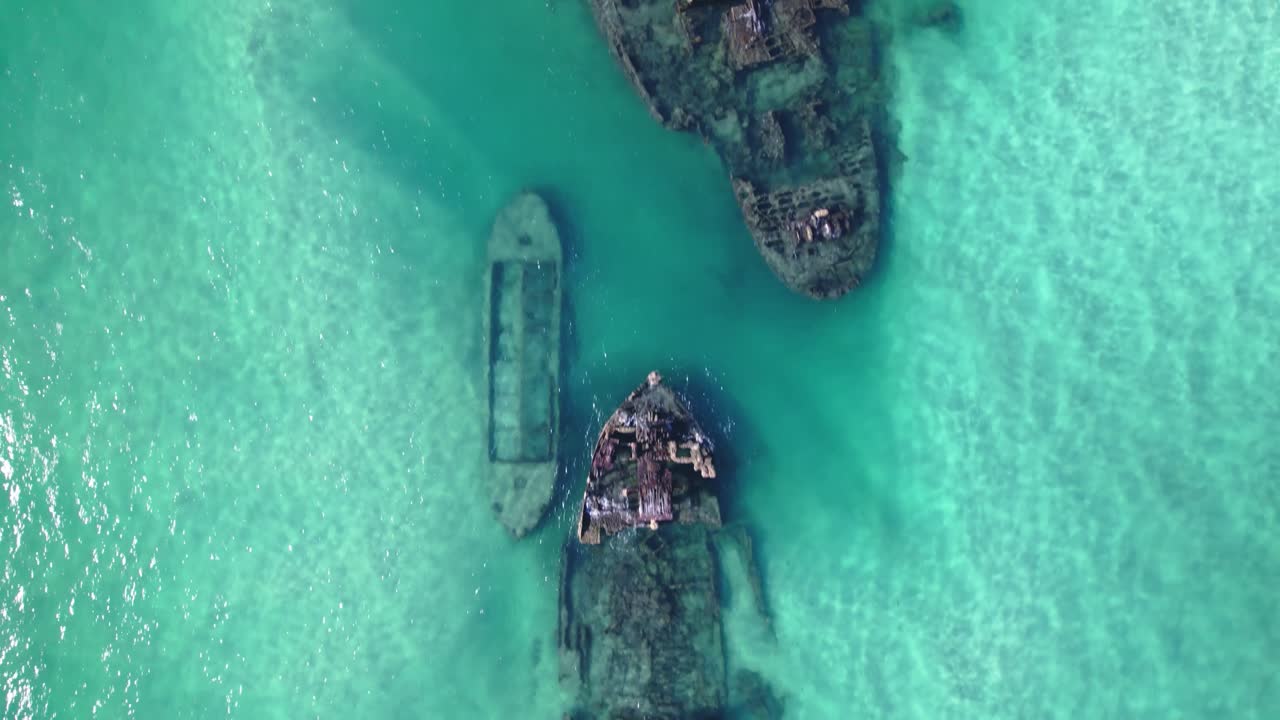 Stunning aerial view of Tangalooma Wrecks in turquoise waters on Moreton Island.