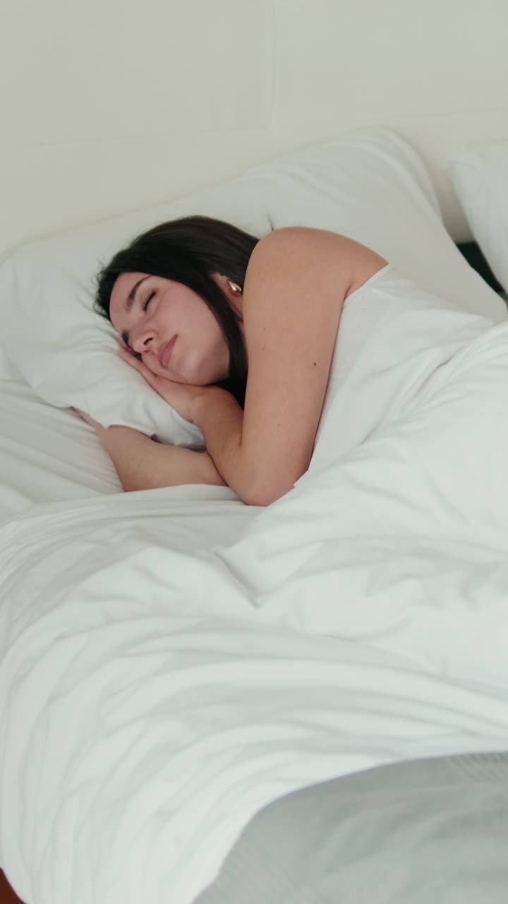 Young Woman Sleeping Peacefully in Bed