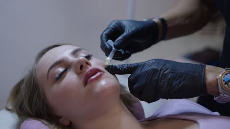 woman receiving a cosmetic injection on her face