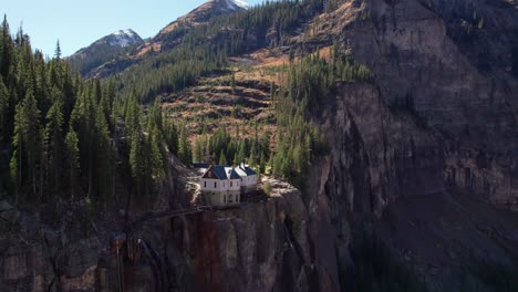 drone shot of the top of bridal veil falls in the fall season in telluride, co