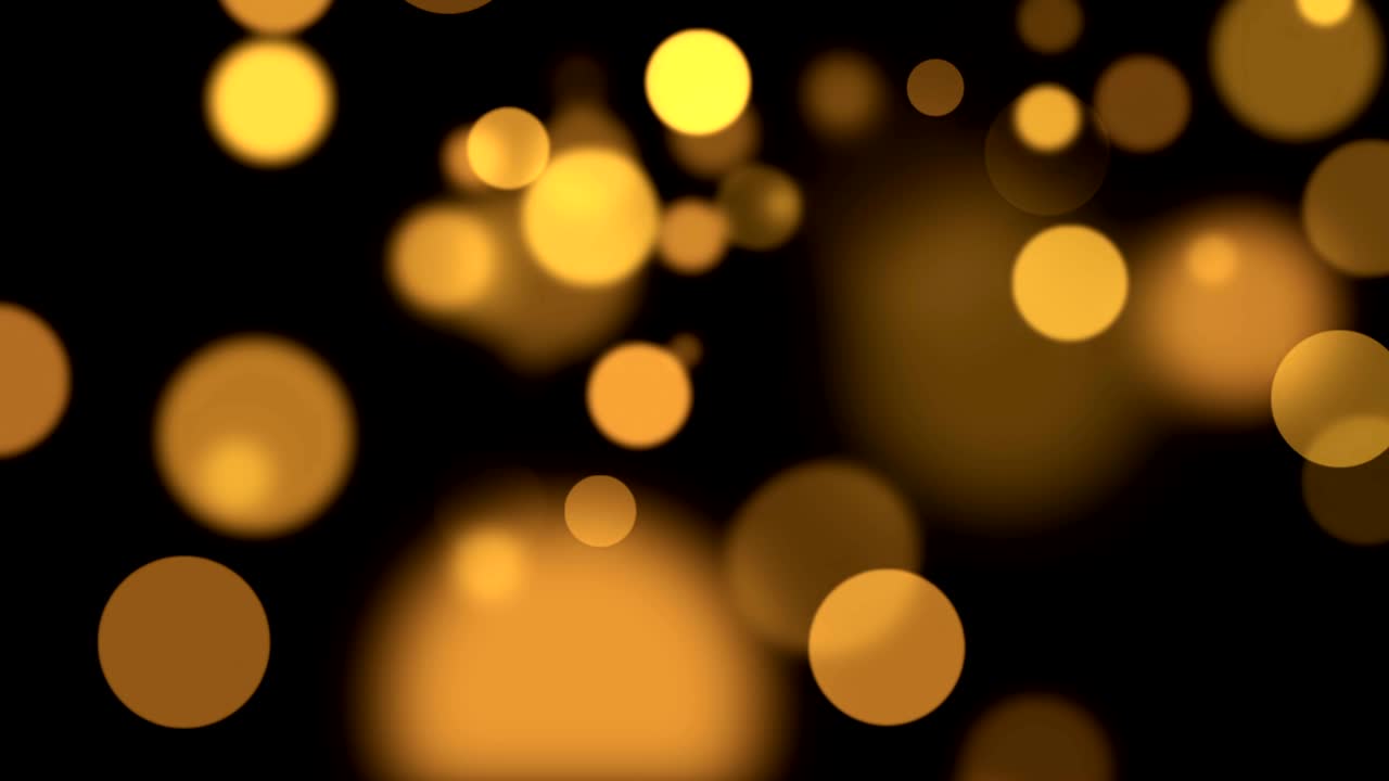 abstracto circular dorado brillo brillo bokeh movimiento de flujo en fondo negro