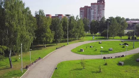 city park with walking path and green spaces