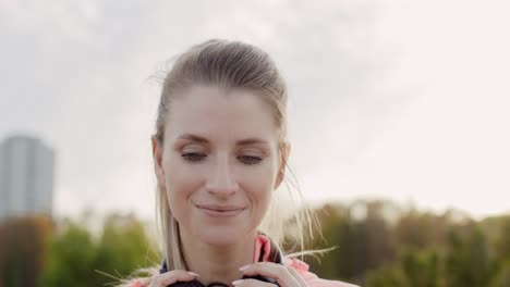 handheld view of woman choosing the best song for jogging