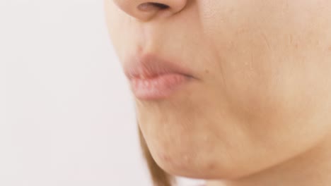 close-up of woman eating wafer. eating chocolate.