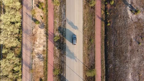 Drone-shot-of-a-car-on-the-street