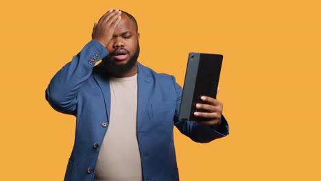 discontented man disappointed by friends words during videoconference