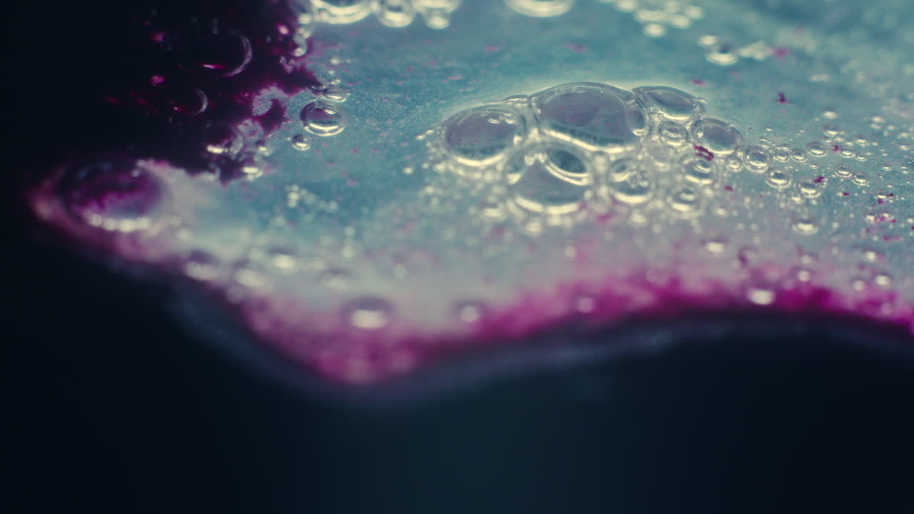 Colourful, organic, liquids macro shots buzzing and flowing