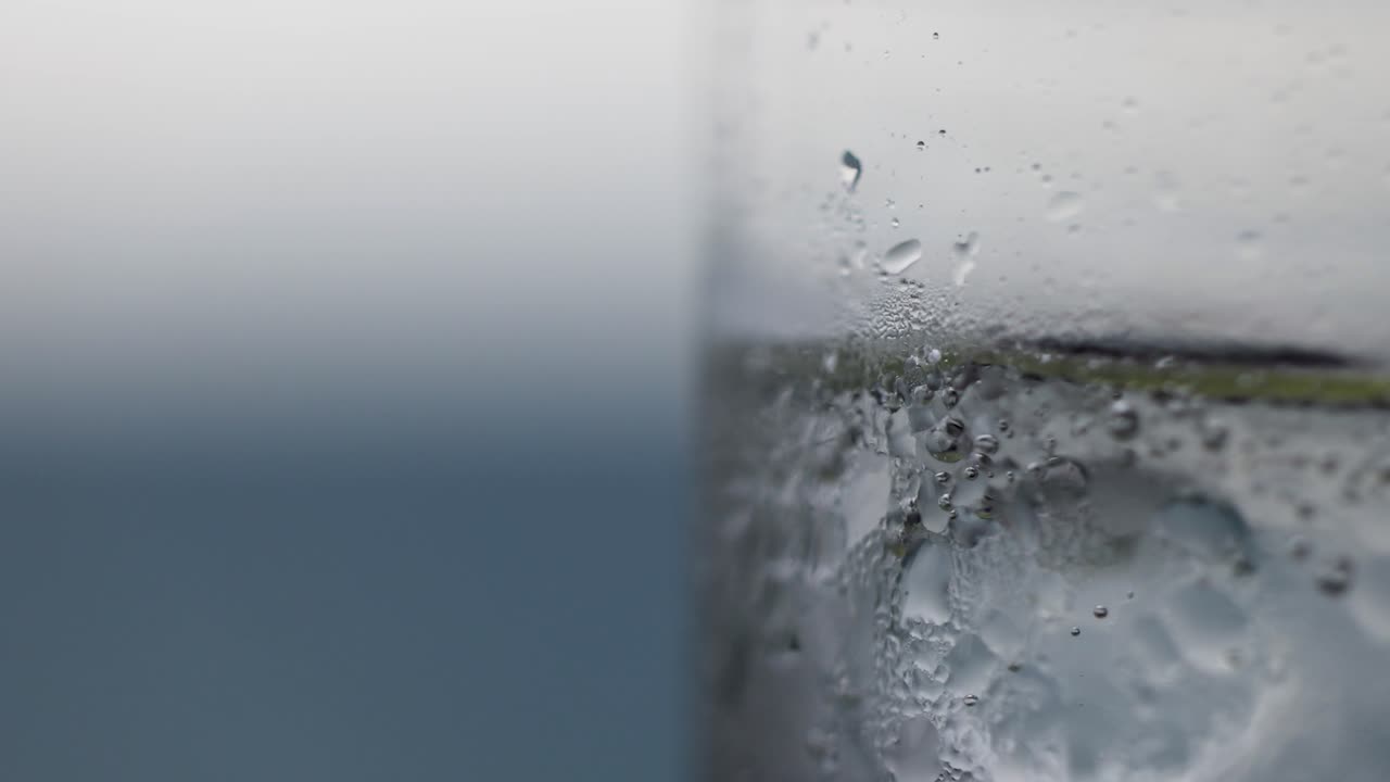 Macro view of lime soda pouring into a glass, highlighting bubbles and condensation in a refreshing scene