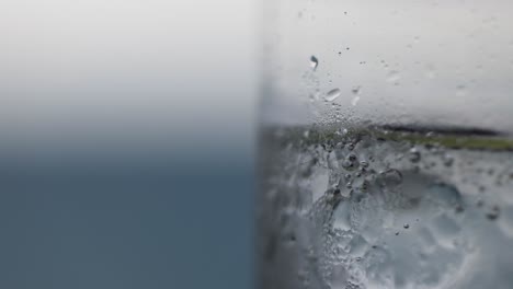 macro view of lime soda pouring into a glass, highlighting bubbles and condensation in a refreshing scene