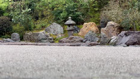 rain falling on the garden of konchi-in temple in kyoto, japan