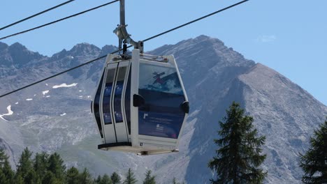 cable cars moving through mountainous landscape in piedmont, italy