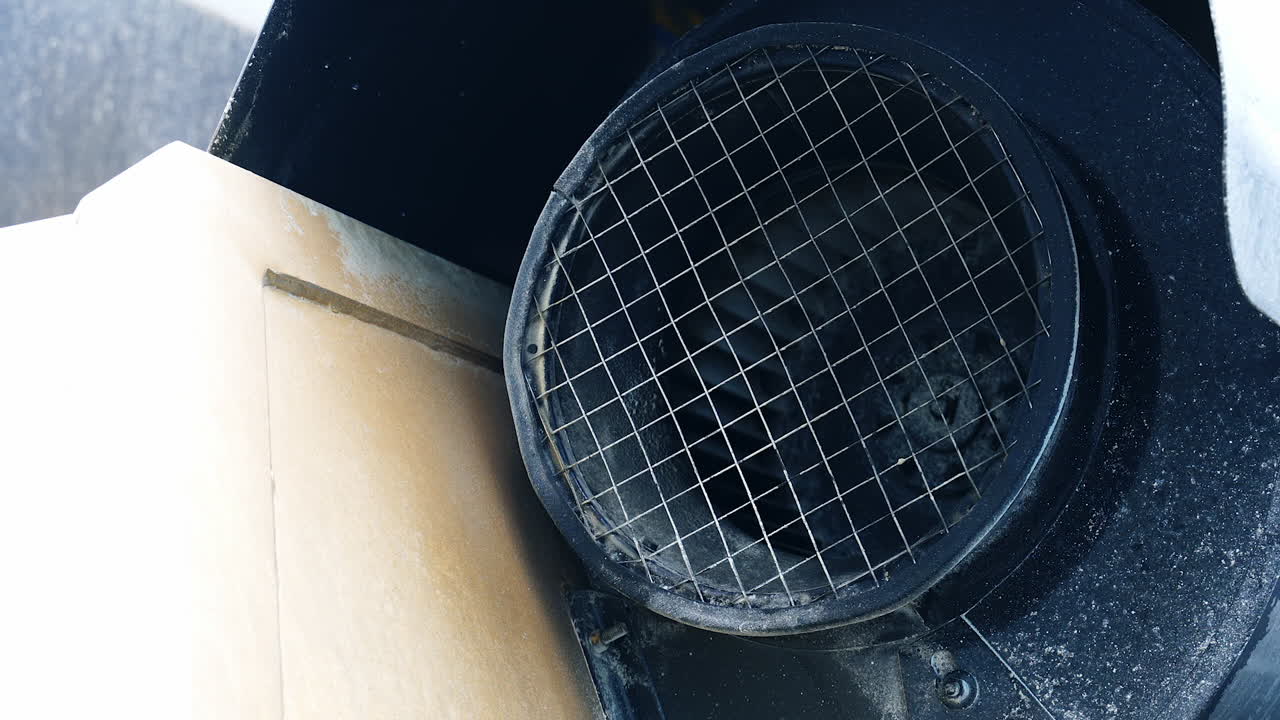 Big diameter tube covered with net and twirling core inside. Industrial equipment outdoors in the exterior of modern plant. Close up.