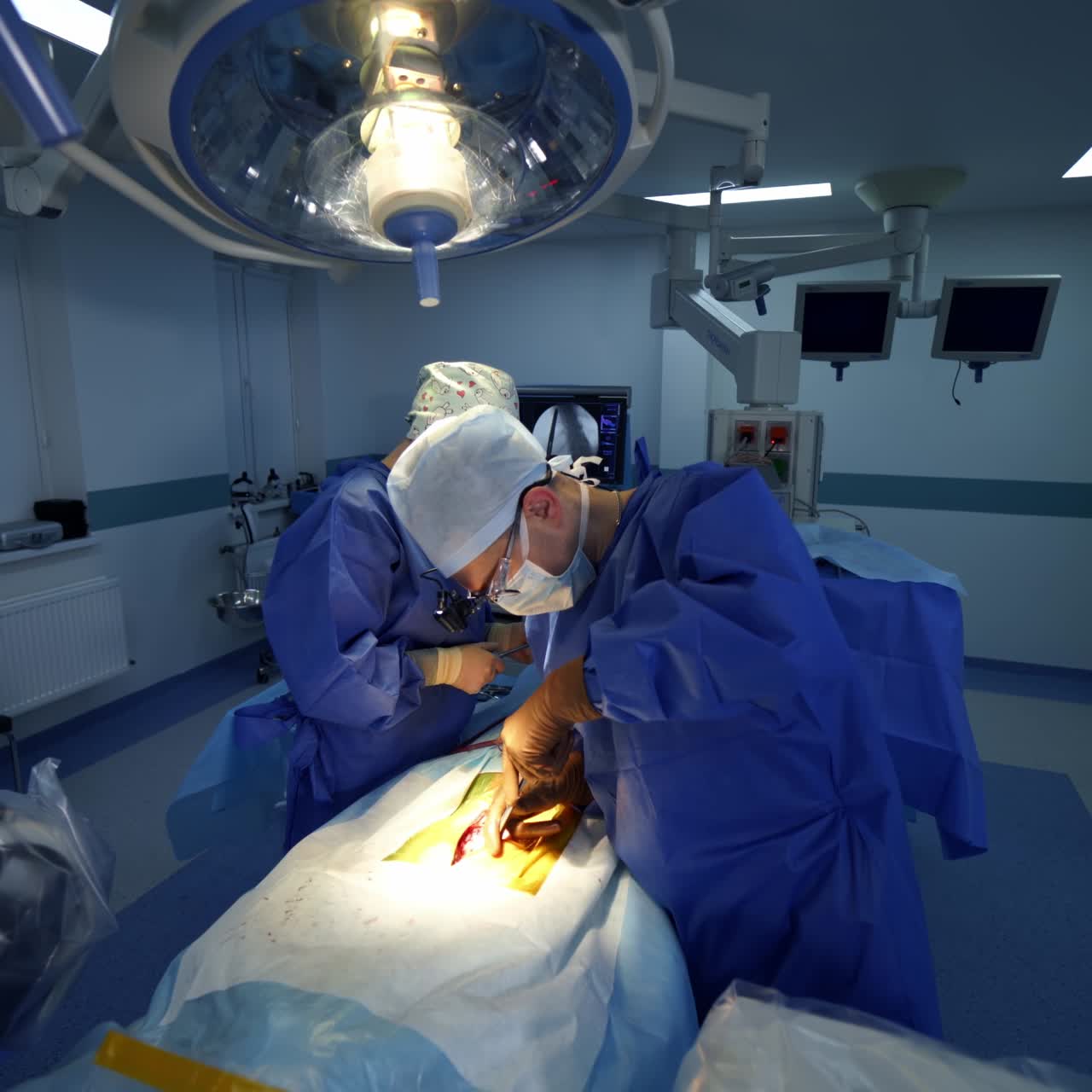 Professional doctors in medical uniform making an operation. Process of operation by neurosurgeons