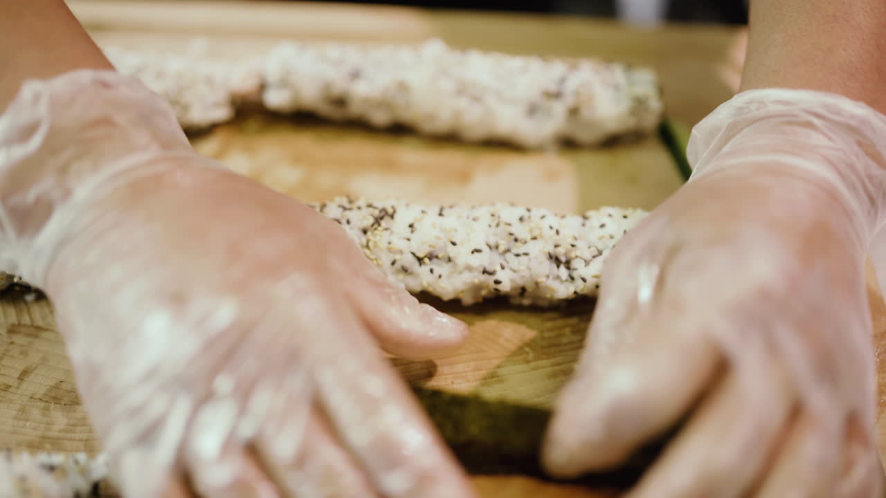 Sushi Preparation by Chef in a Restaurant