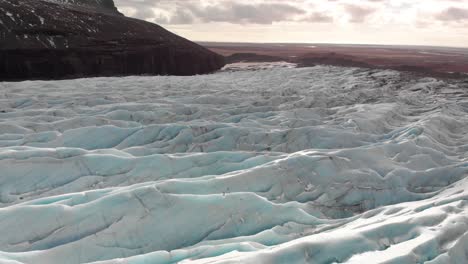 drone shot above vatnajokull glacier in iceland during winter