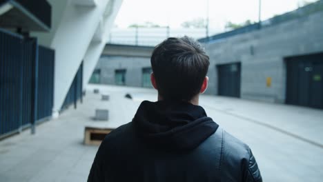 lonely man walking on empty city street