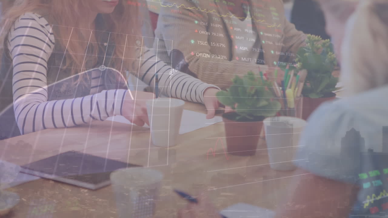 Animation of data processing against mid section of diverse colleagues discussing at office
