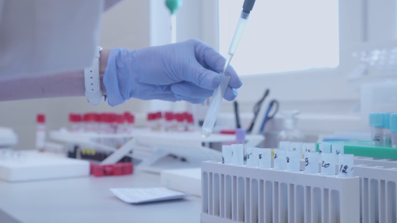 Lab Assistant Working with Samples in a Laboratory Setting