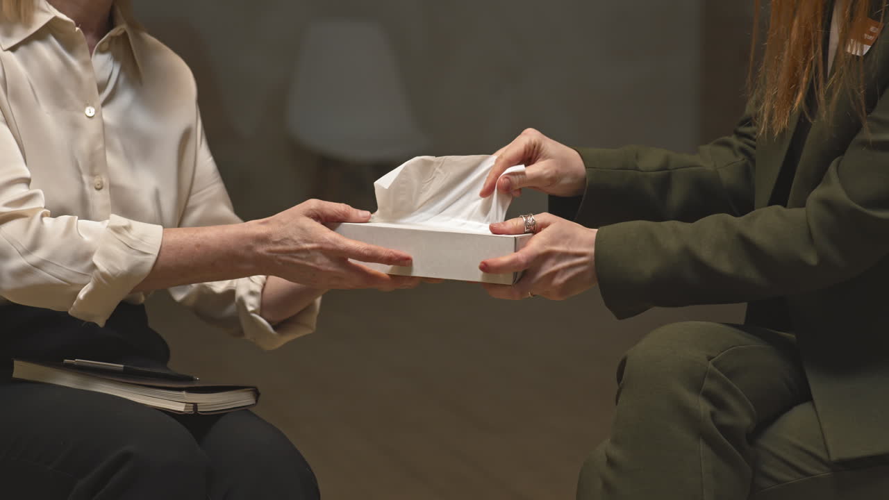 Crying Woman Wiping Tears with Tissues at Psychotherapy Session