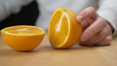 cutting fruit in half with a sharp knife