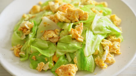 homemade stir-fried cabbage with egg on plate