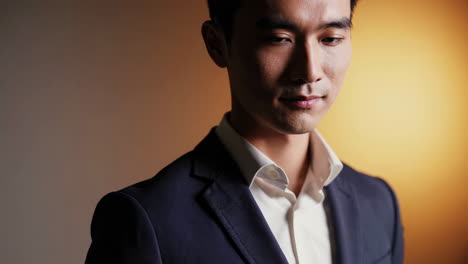 close-up of a well-dressed asian man in a suit