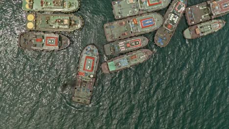 top down view over tug boats manoeuvring at taganito in the philippines