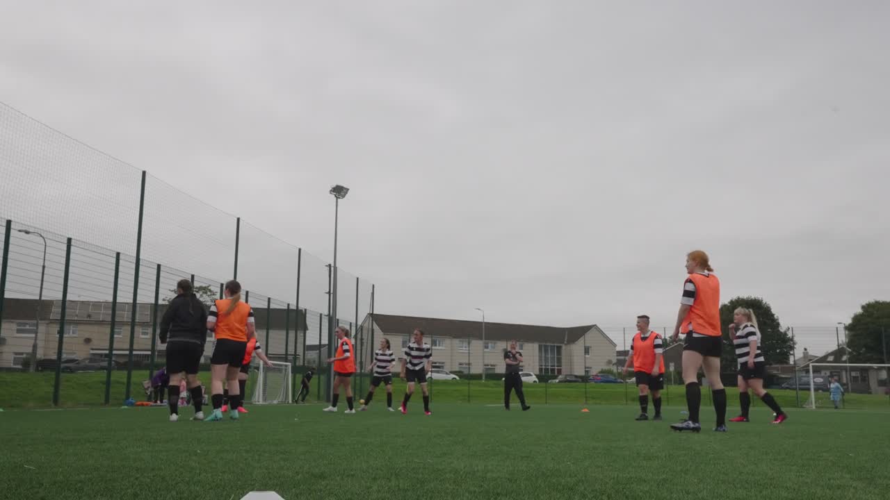 Women warm up strong, with fire inside, ready to face the game with pride