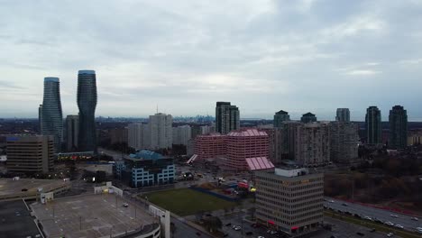 aerial shot flying over foggy and rainy downtown area of mississauga
