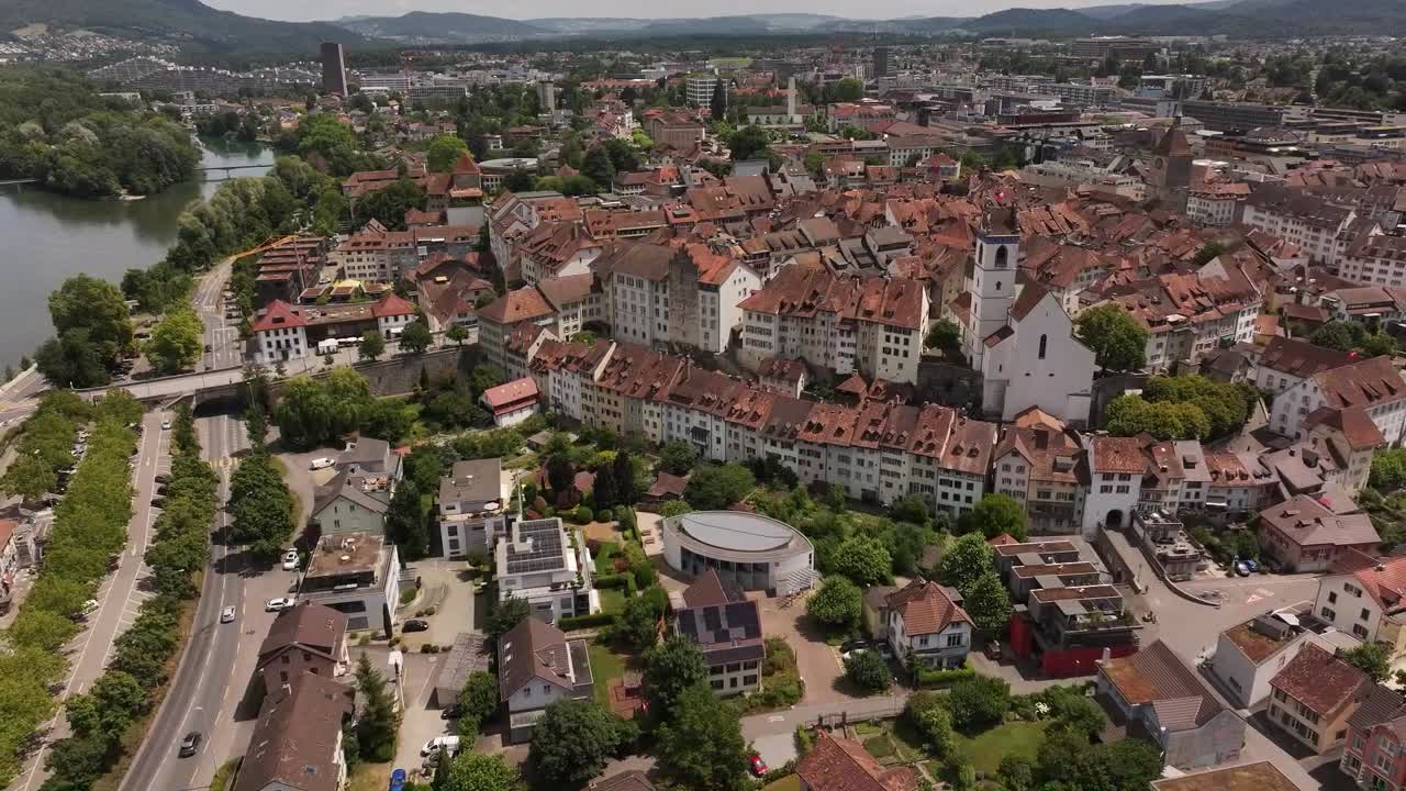 Aerial view of Aarau, the capital of the canton of Aargau, Switzerland. The historic old town with its signature red-tiled rooftops, narrow streets, and the Aare River flowing beside it