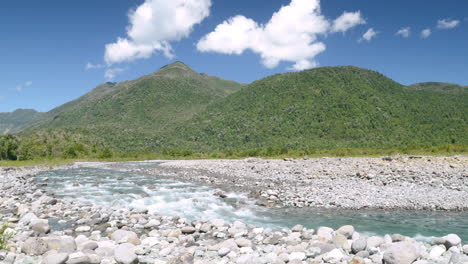 Mountains-clouds-and-the-clear-blue-waters-of-the-Huequi-River-in-Southern-Chile